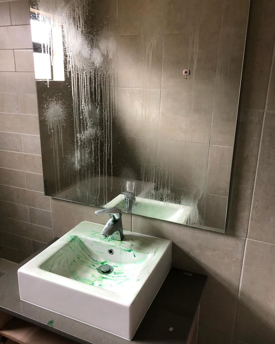 Post-Build Basin & Mirror — before Dynamic Express Consultants cleaned it