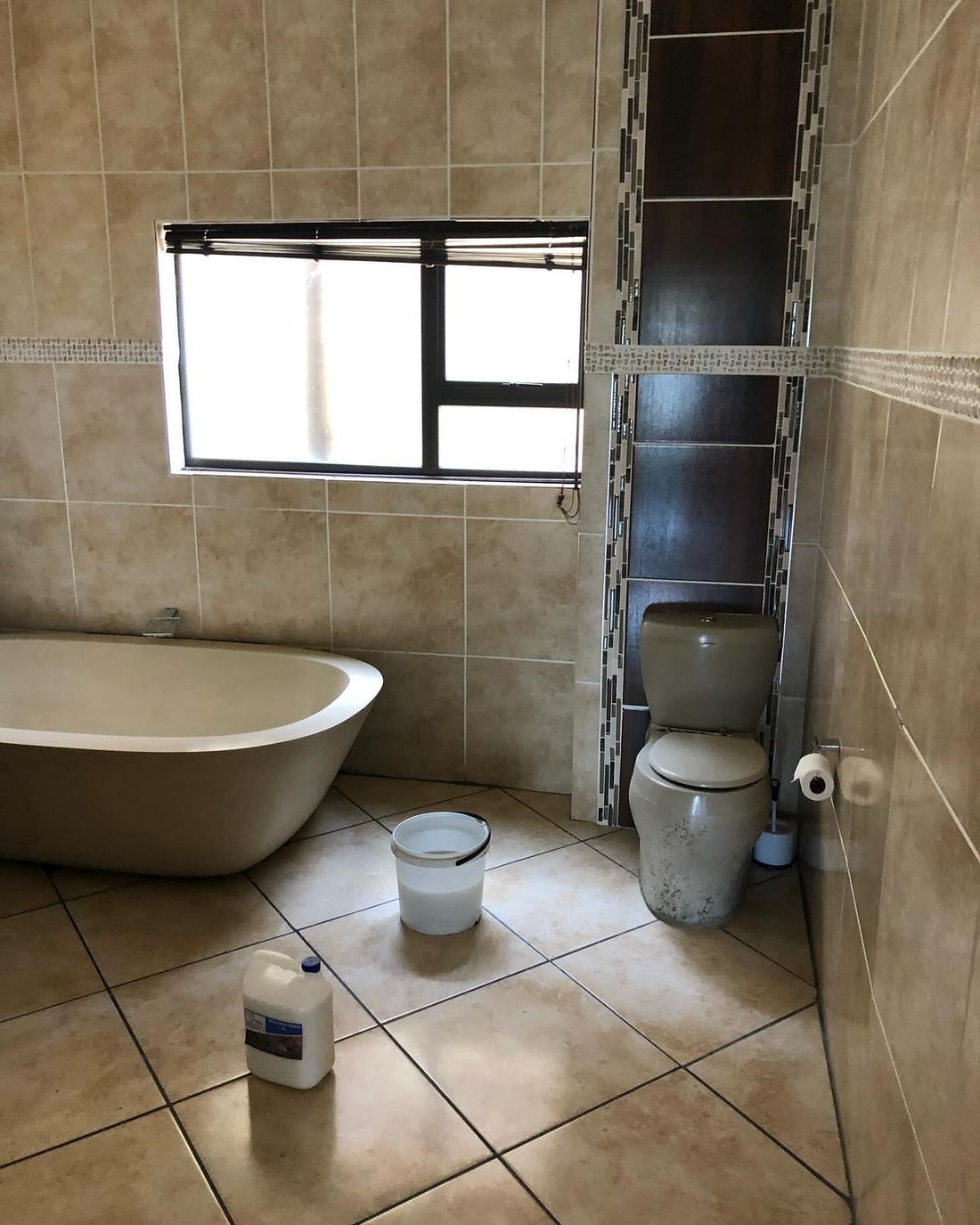 Bathroom Handover Clean — before Dynamic Express Consultants cleaned it