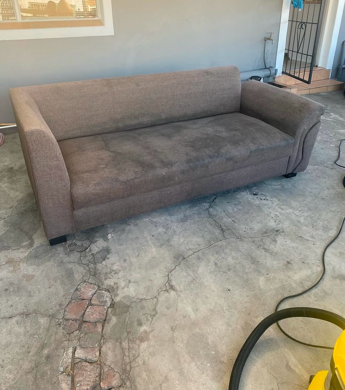 Lounge Couch Stain Removal — before Dynamic Express Consultants cleaned it